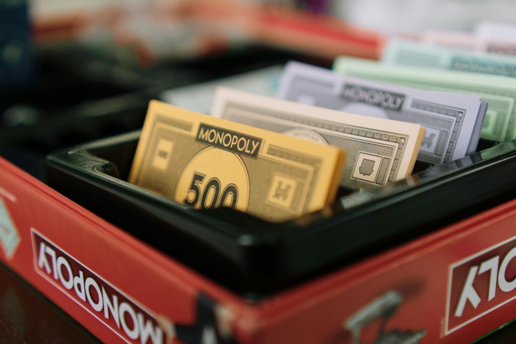 Detailed view of Monopoly game money and box, ideal for board game enthusiasts.